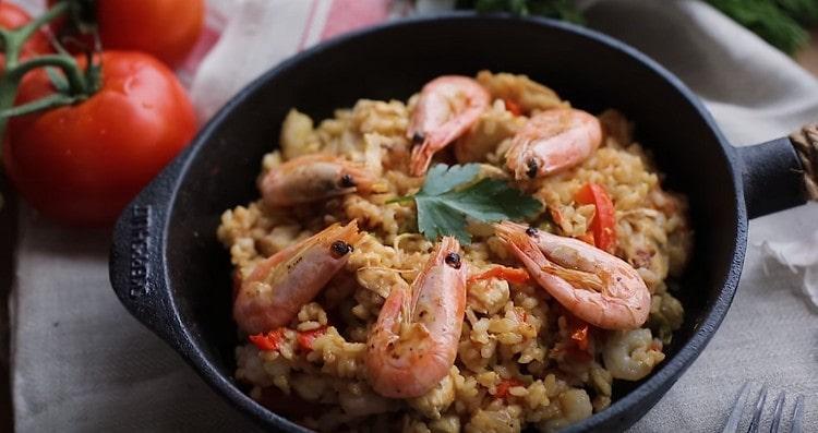 A gourmet shrimp paella is ready.