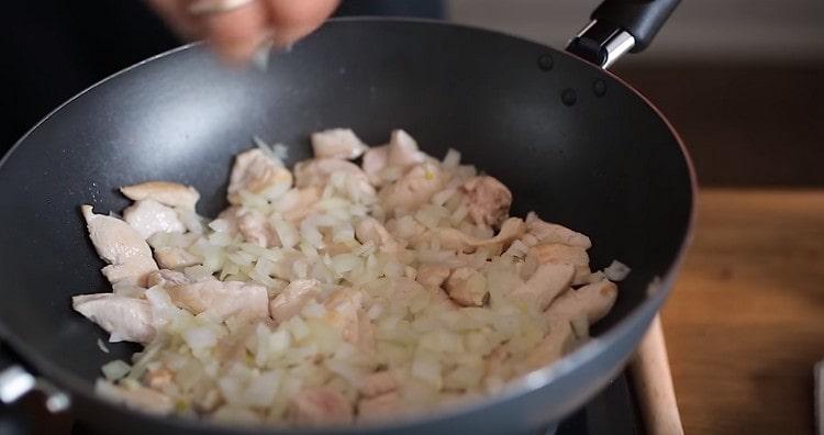 In the pan, add the onion to the meat.