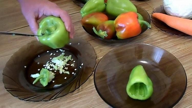 Cooking peppers stuffed with vegetables and rice