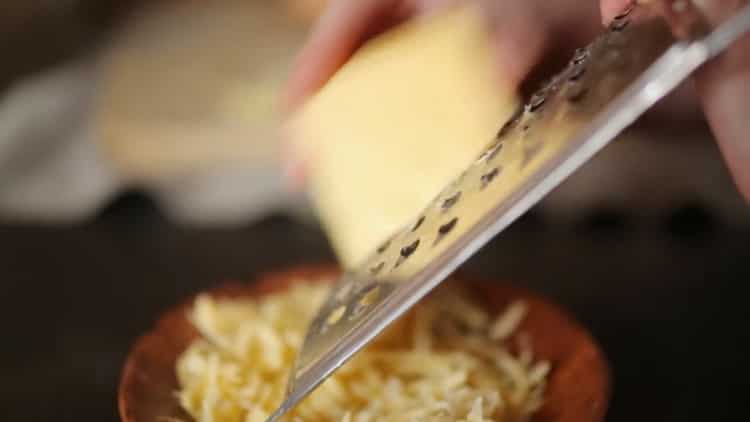 Grate cheese to make a pie