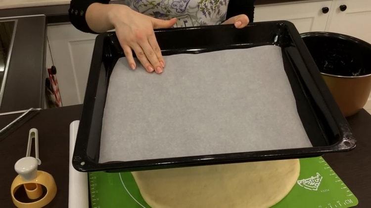 To make American donuts, prepare a baking sheet