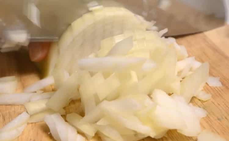 To make cabbage rolls, chop onion