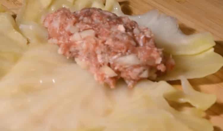 For the preparation of cabbage rolls, lay the filling on a sheet
