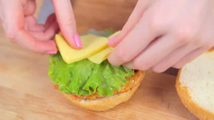 To make a crabsburger, chop the cheese