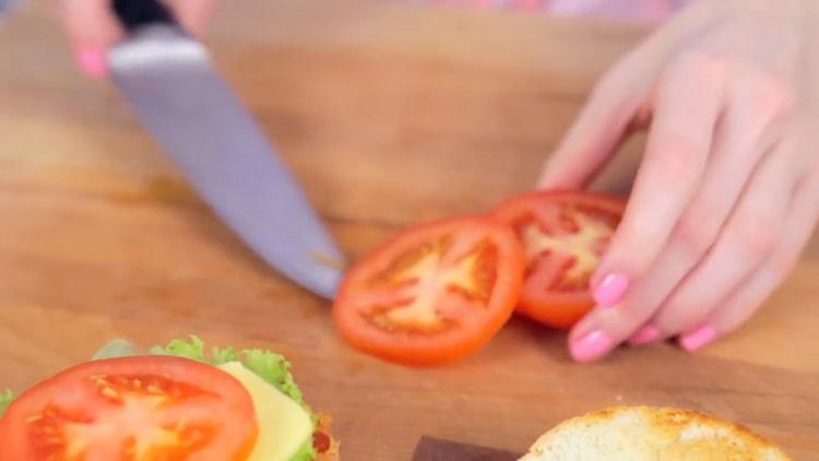 To cook a crabsburger, chop the tomato