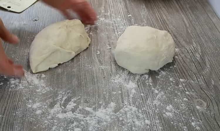 To make khachapuri, divide the dough