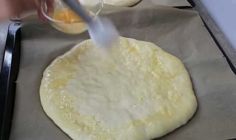 To make khachapuri, oil the cake