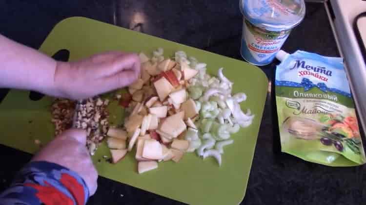 Chop nuts to make a salad