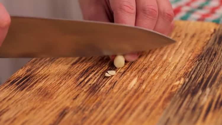Chop the garlic to make the beans