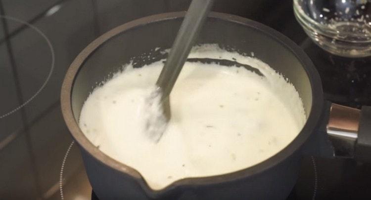 Stirring constantly, cook the sauce until the cheeses are completely dissolved.