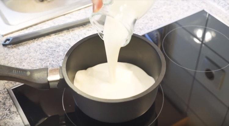 Heat the cream in a saucepan.