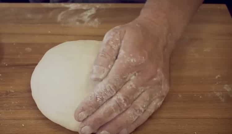 Mix the ingredients for the pizza dough.