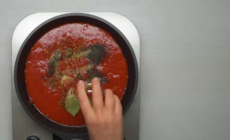 To cook meatballs, add spices to the sauce