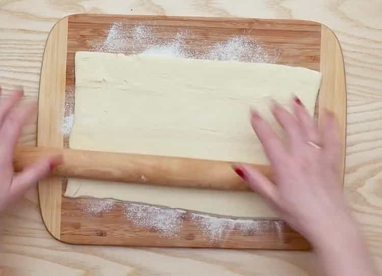 Roll dough to make meatballs