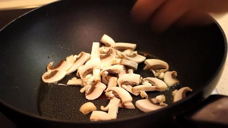 To cook, fry the mushrooms