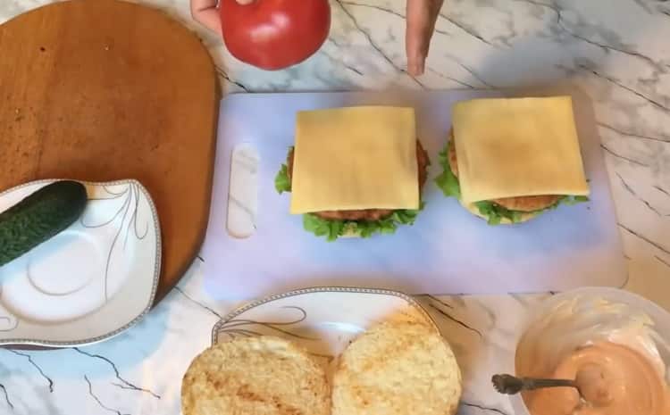 To make a chickenburger, place the cheese on a bun