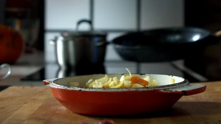 We shift onions with carrots into a baking dish.