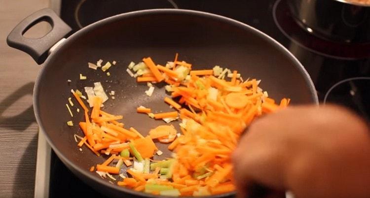 Add carrots to the onion.