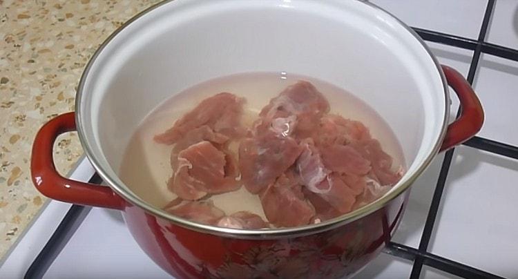 Boil the meat until cooked.