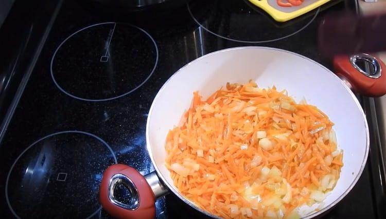 Add carrot to the onion.
