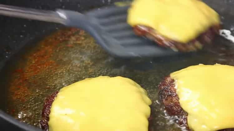 To make a hamburger, fry the patties with cheese