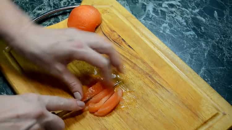 Cut tomatoes to cook