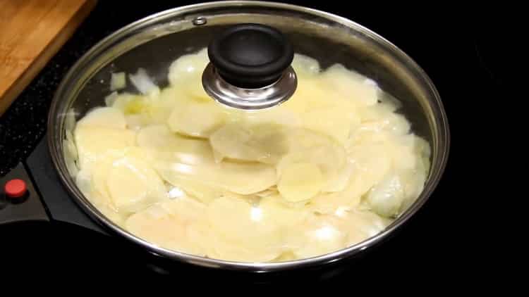 Fry potatoes to make tortilla