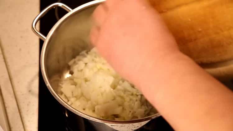 Fry the onion to make the soup.