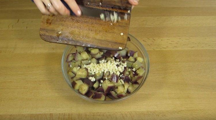Add chopped garlic to the eggplant.