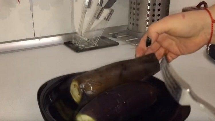 we take out eggplants from water and cool.