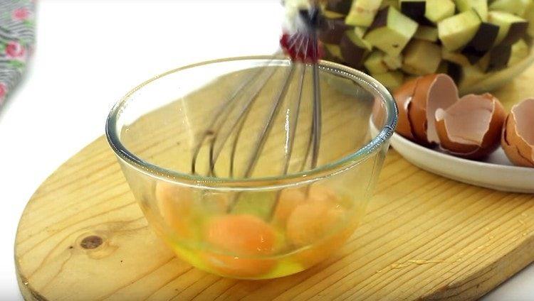 Beat eggs with a whisk.