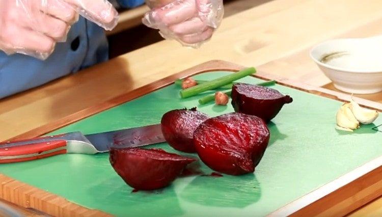 cut the beets in half and peel them.