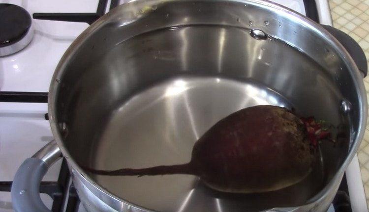 Boil the beets until cooked.