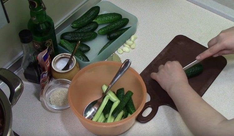 I wash the cucumbers and cut into 4 parts each.