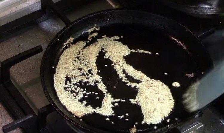 fry sesame in a pan.