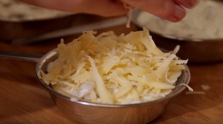 Sprinkle each portion of the dish with grated cheese.