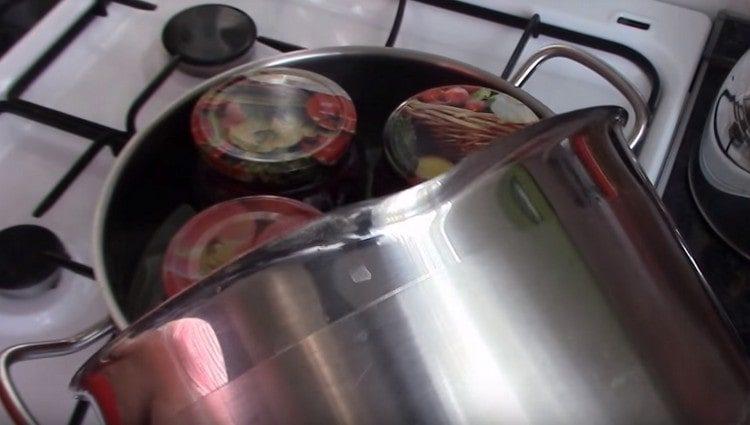 Add water to the pan so that the cans are immersed in it at the very neck.