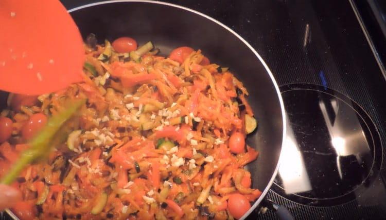 At the end of cooking, add chopped garlic to the dish.