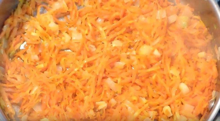 Add carrots to the onion.