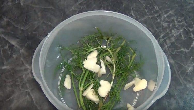 Put rosemary sprigs in the pan, add the garlic.