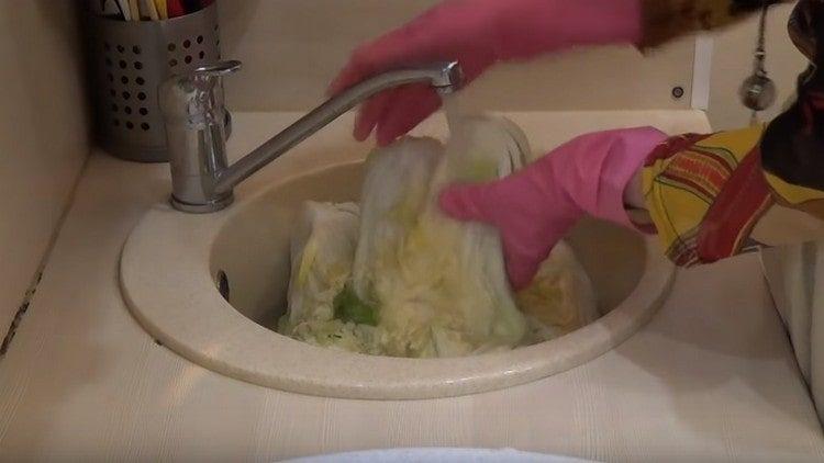 Cabbage let juice and become soft, now we wash it.