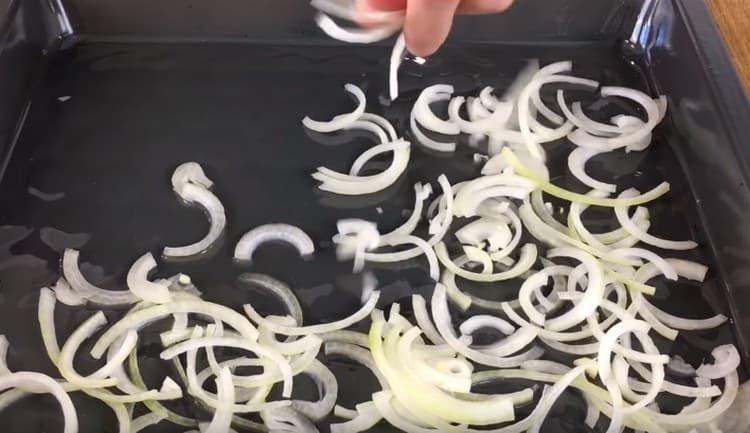 Put a layer of onion on a baking sheet.