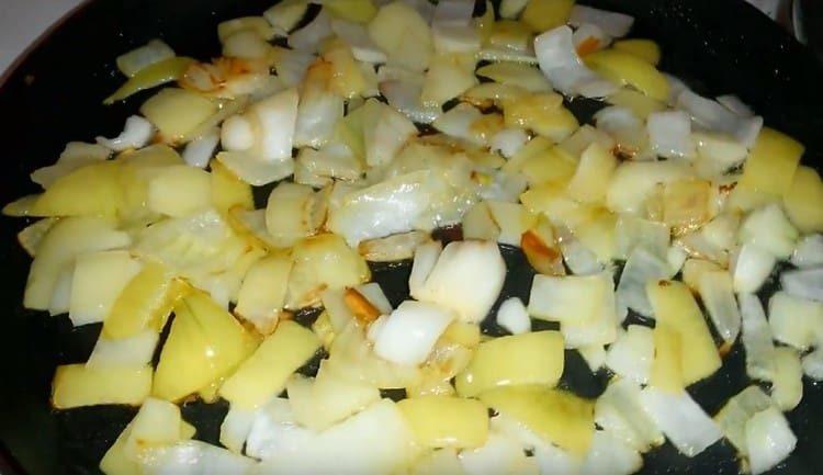 In a pan, fry chopped onions until golden.