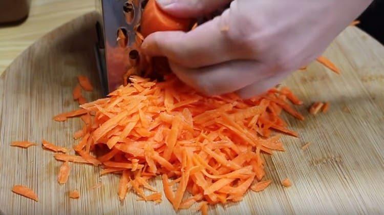 Three carrots on a coarse grater.