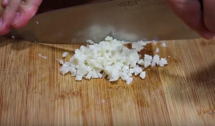 Finely chop the garlic.