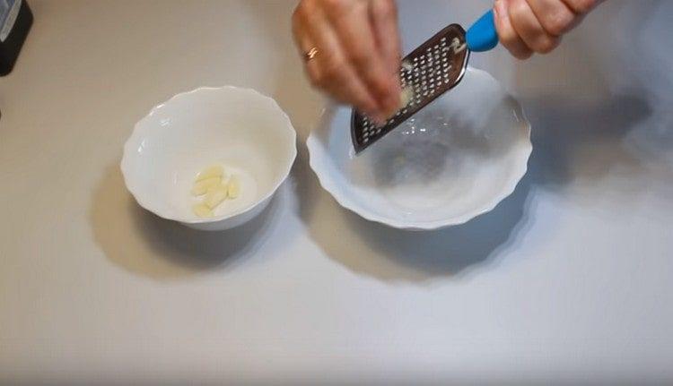 chop the garlic to make salad dressing.