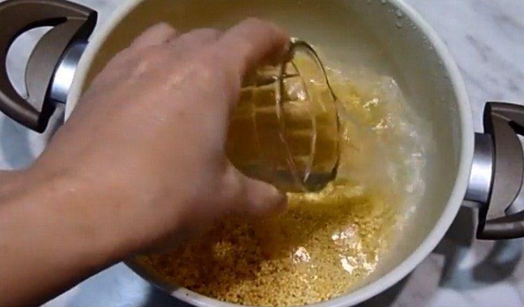 Filled washed millet in a pan with water.