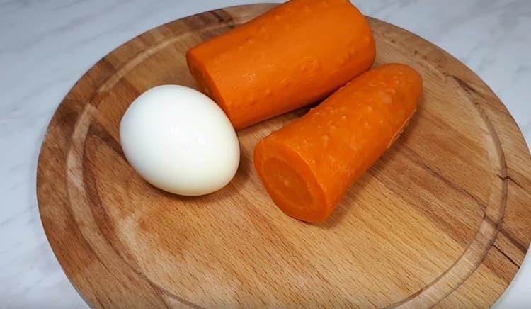 For dyeing dishes, we need one boiled egg and carrots.