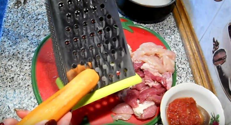 three carrots on a coarse grater.