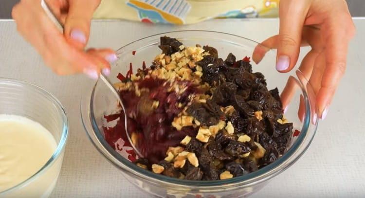 Add prunes to beets with nuts, mix.